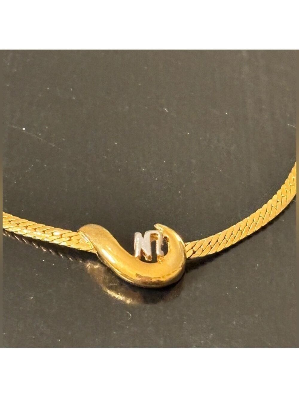 Nina Ricci Gold Necklace with Silver Accent